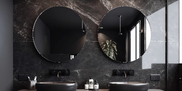 Close up of double black sink with mirrors standing in on dark marble wall , wooden cabinet with faucet in minimalist bathroom. Front view